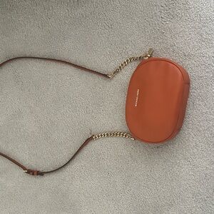 Michael Kors Orange and Gold Crossbody Bag with Modern Elegance